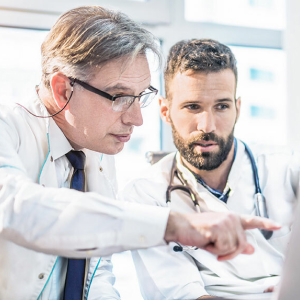 doctor explaining whats on the computer screen